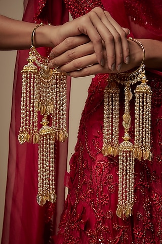 Gold Finish Pearl & Hanging Charm Tying Kaleeras (Set Of 2) by Vivinia By Vidhi Mehra