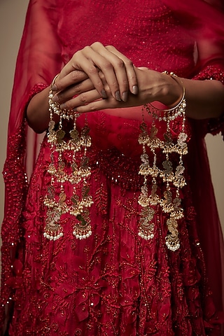 Gold Finish Shell & Face Charm Bangle Kaleeras (Set Of 2) by Vivinia By Vidhi Mehra