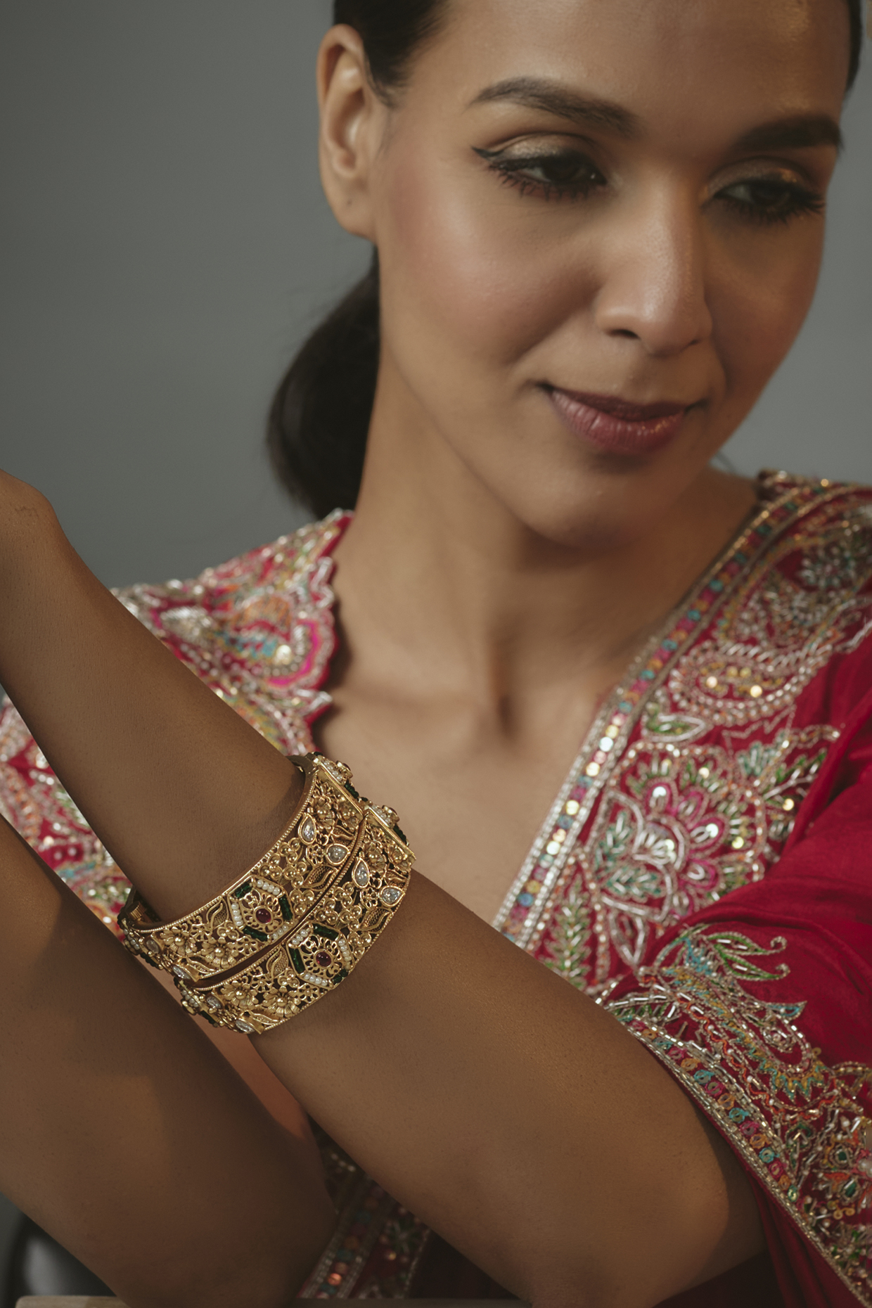 Gold Finish Onyx Bangles (Set Of 2) by Vivinia By Vidhi Mehra at Pernia's Pop Up Shop