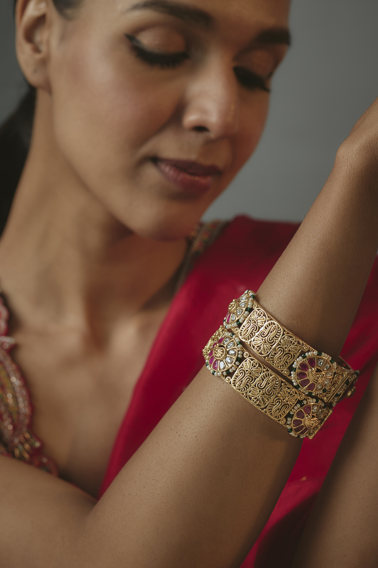 Gold Finish Onyx Stone Bangles (Set Of 2) by Vivinia By Vidhi Mehra at Pernia's Pop Up Shop