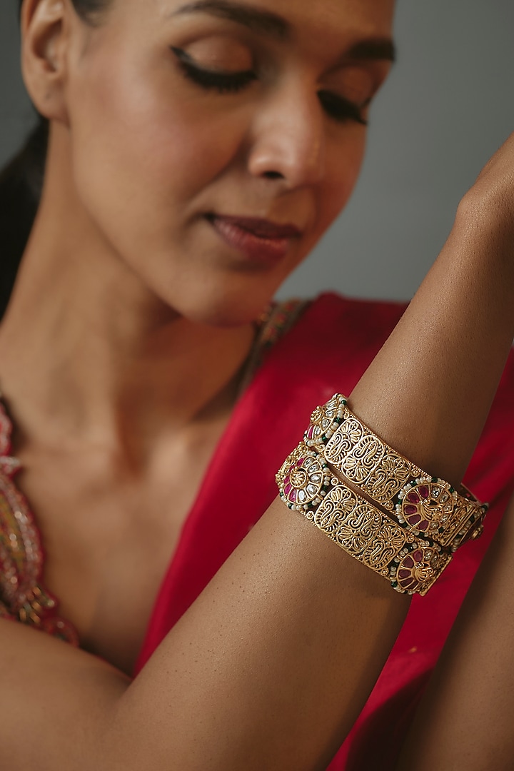 Gold Finish Onyx Stone Bangles (Set Of 2) by Vivinia By Vidhi Mehra at Pernia's Pop Up Shop