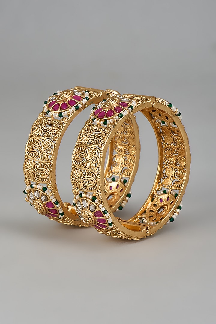 Gold Finish Onyx Stone Bangles (Set Of 2) by Vivinia By Vidhi Mehra at Pernia's Pop Up Shop