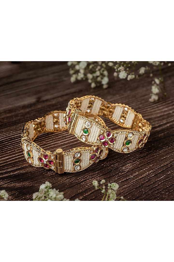Gold Finish Pink & Green Gemstone Beaded Bangles (Set Of 2) by Vivinia By Vidhi Mehra at Pernia's Pop Up Shop