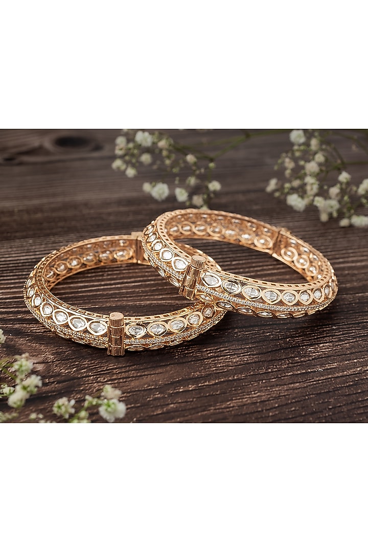 Gold Finish Kundan Polki & White Stone Bangles (Set Of 2) by Vivinia By Vidhi Mehra at Pernia's Pop Up Shop