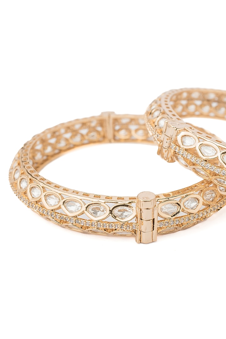 Gold Finish Kundan Polki & White Stone Bangles (Set Of 2) by Vivinia By Vidhi Mehra at Pernia's Pop Up Shop