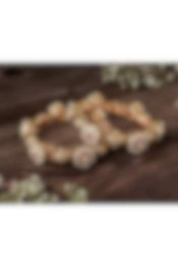 Gold Finish Ruby Stone & Diamond Floral Motif Bangles (Set Of 2) by Vivinia By Vidhi Mehra at Pernia's Pop Up Shop