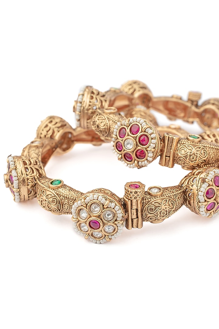 Gold Finish Ruby Stone & Diamond Floral Motif Bangles (Set Of 2) by Vivinia By Vidhi Mehra at Pernia's Pop Up Shop