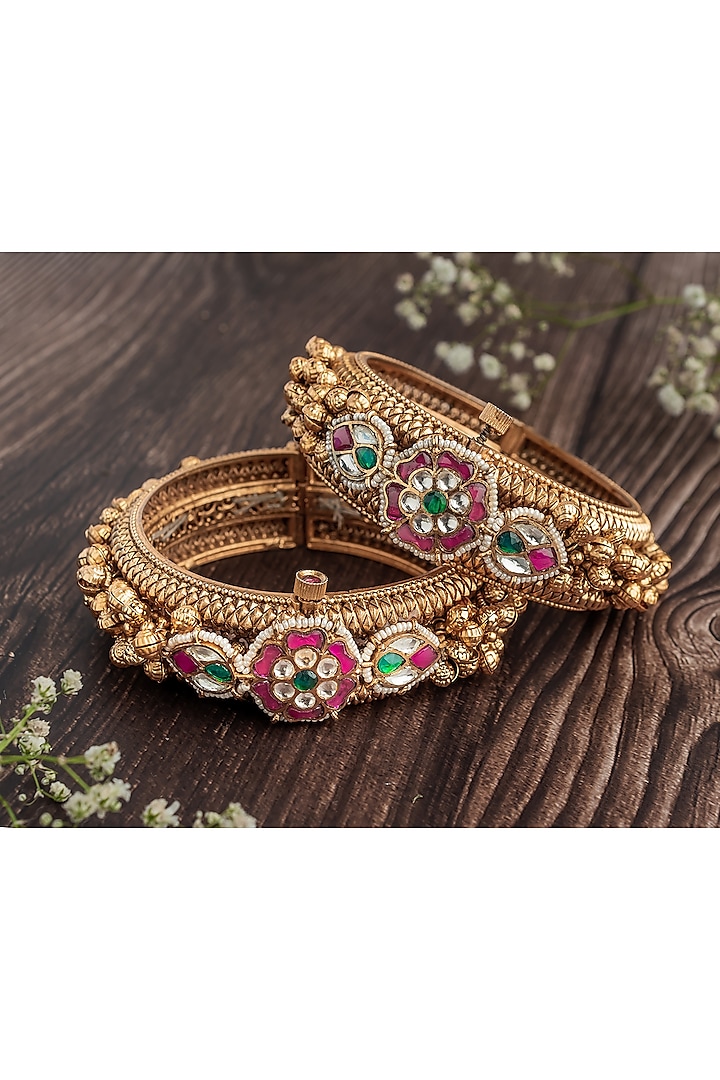 Gold Finish Ruby Stone & Diamond Floral Motif Bangles (Set Of 2) by Vivinia By Vidhi Mehra at Pernia's Pop Up Shop