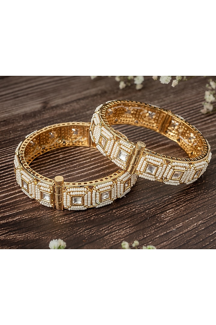 Gold Finish White Stone Beaded Bangles (Set Of 2) by Vivinia By Vidhi Mehra at Pernia's Pop Up Shop