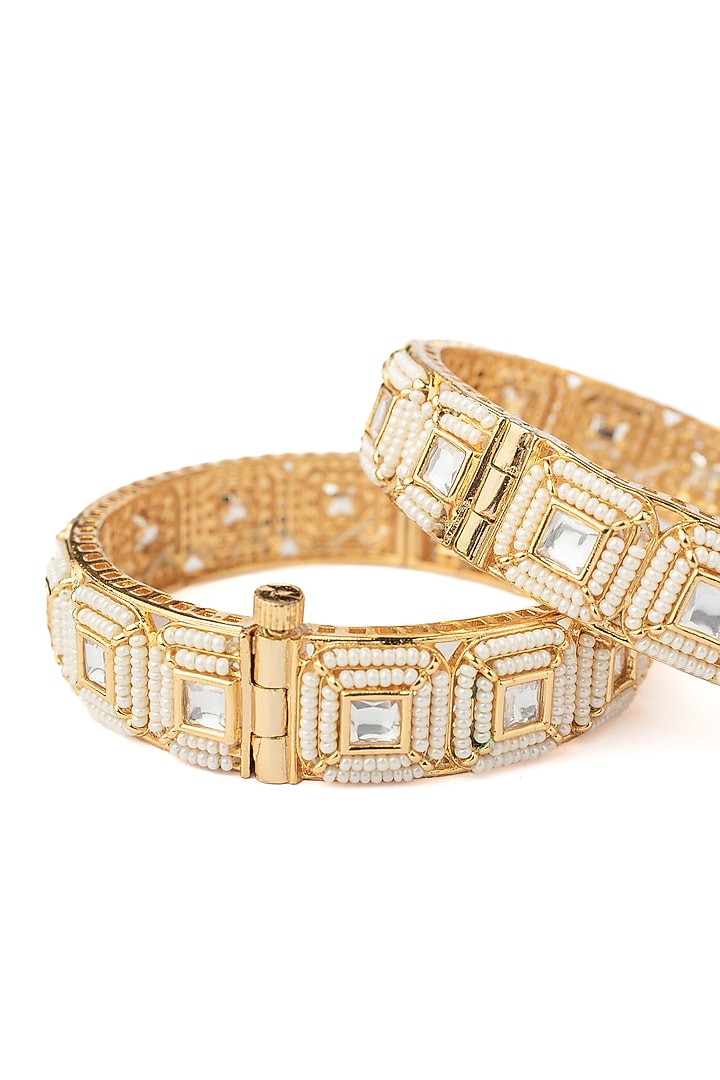 Gold Finish White Stone Beaded Bangles (Set Of 2) by Vivinia By Vidhi Mehra at Pernia's Pop Up Shop