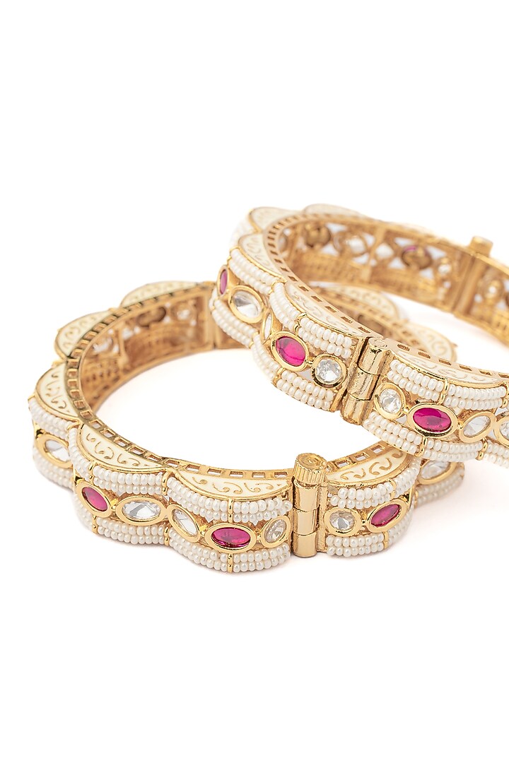 Gold Finish White & Pink Stone Beaded Bangles (Set Of 2) by Vivinia By Vidhi Mehra at Pernia's Pop Up Shop
