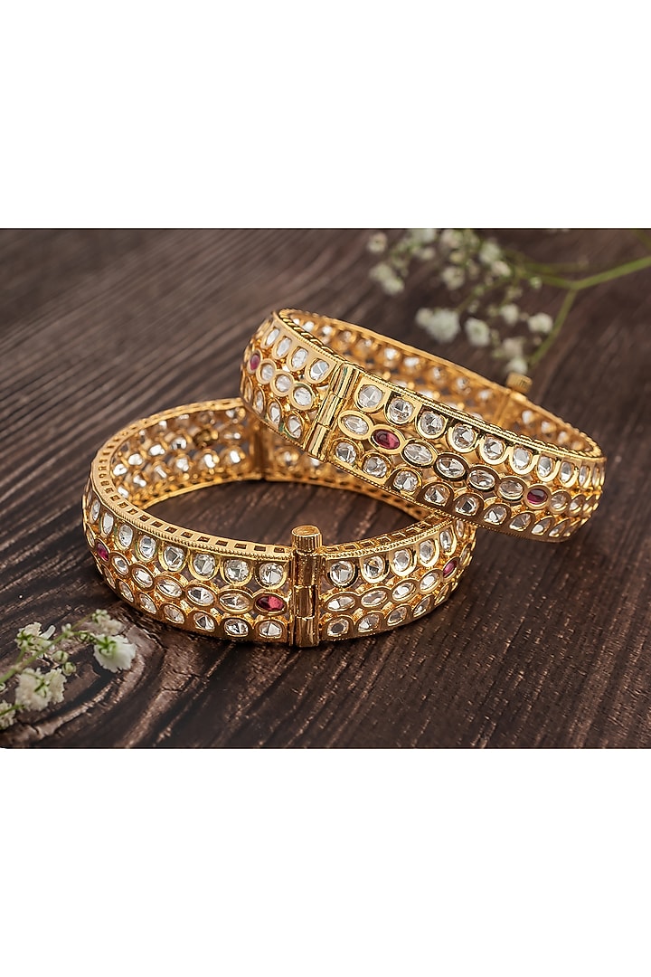 Gold Finish Kundan Polki Floral Bangles (Set Of 2) by Vivinia By Vidhi Mehra at Pernia's Pop Up Shop