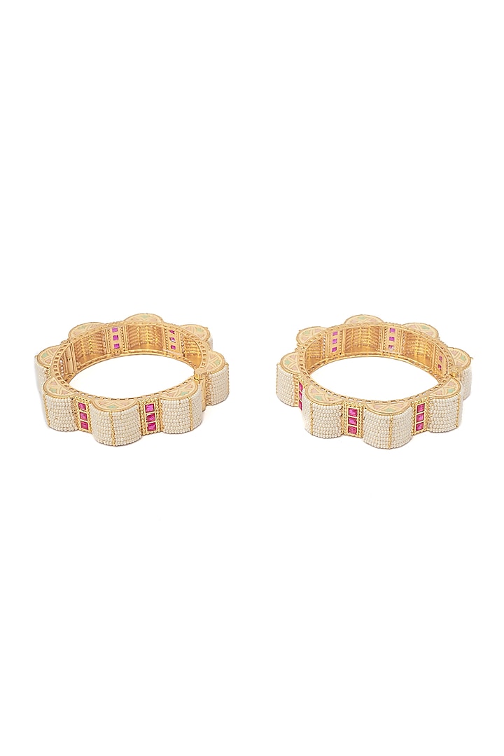 Gold Finish Pink Stones & White Beaded Bangles (Set Of 2) by Vivinia By Vidhi Mehra at Pernia's Pop Up Shop