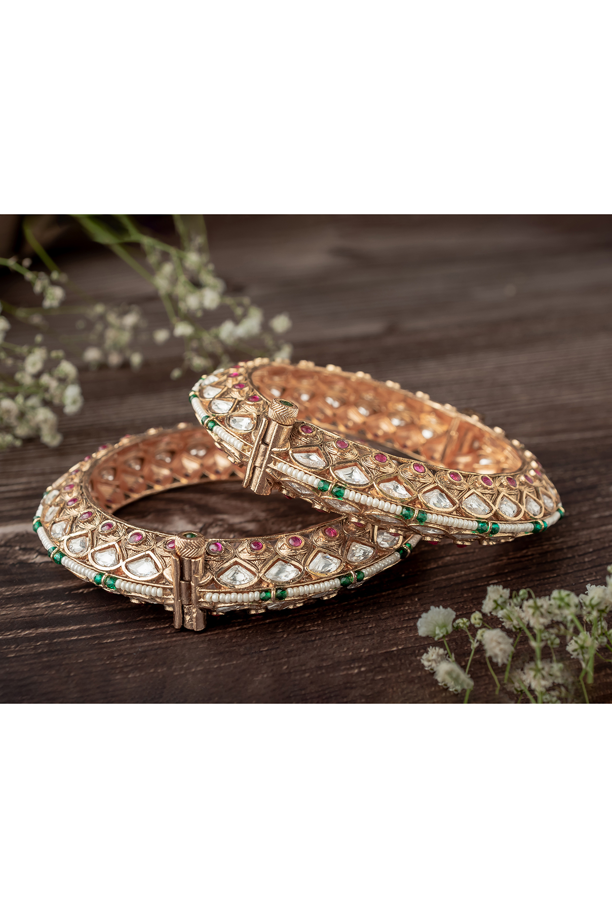 Gold Finish White Tear-Drop Shaped Stone Enameled Bangles (Set Of 2) by Vivinia By Vidhi Mehra at Pernia's Pop Up Shop