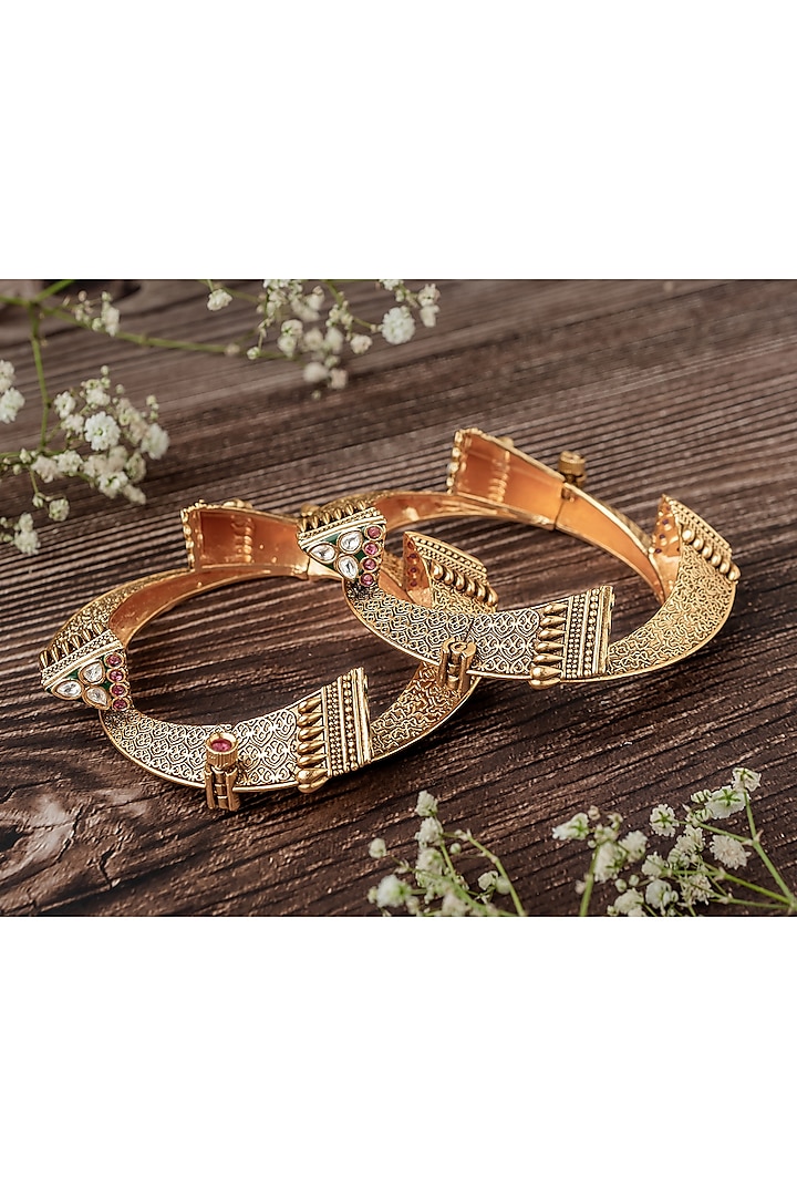 Gold Finish Multi-Colored Stone Temple Bangles (Set Of 2) by Vivinia By Vidhi Mehra at Pernia's Pop Up Shop