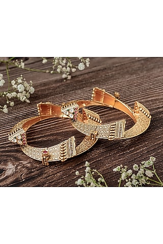 Gold Finish Multi-Colored Stone Temple Bangles (Set Of 2) by Vivinia By Vidhi Mehra
