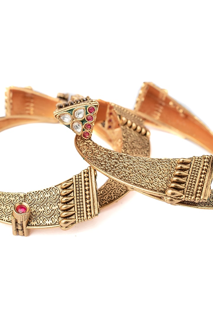 Gold Finish Multi-Colored Stone Temple Bangles (Set Of 2) by Vivinia By Vidhi Mehra at Pernia's Pop Up Shop