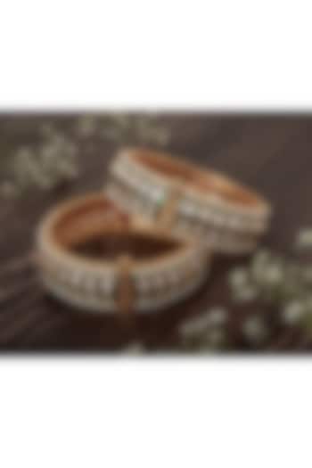 Gold Finish Kundan Polki & Green Stone Bangles (Set Of 2) by Vivinia By Vidhi Mehra at Pernia's Pop Up Shop