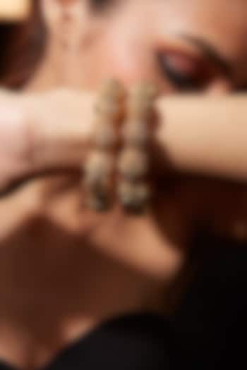 Gold Finish Textured Bangles (Set Of 2) by Vivinia By Vidhi Mehra at Pernia's Pop Up Shop