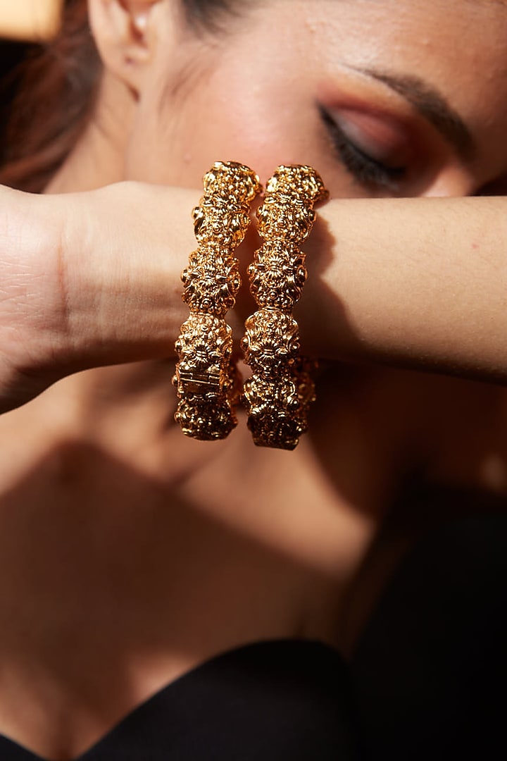 Gold Finish Textured Bangles (Set Of 2) by Vivinia By Vidhi Mehra at Pernia's Pop Up Shop