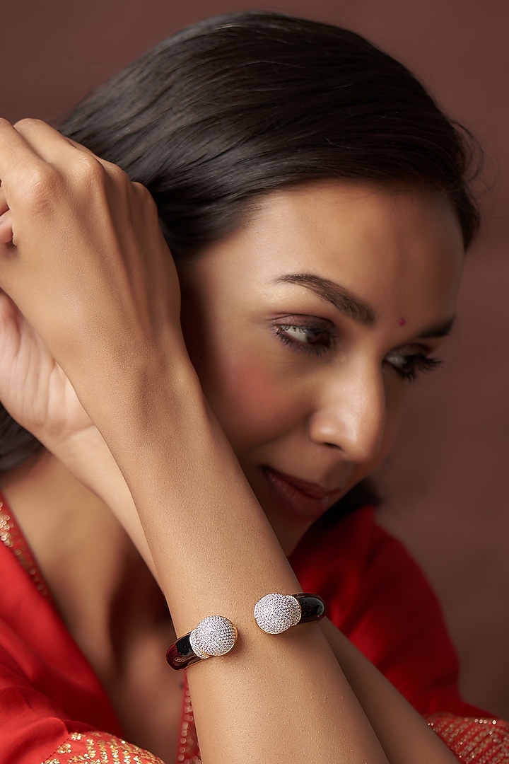 Gold Finish Zircon Bangle by Vivinia By Vidhi Mehra at Pernia's Pop Up Shop