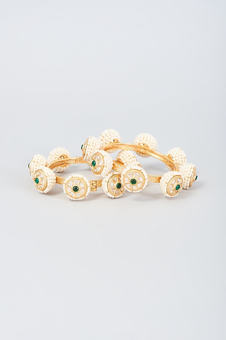 Gold Finish Pearl Bangles (Set Of 2) by Vivinia By Vidhi Mehra at Pernia's Pop Up Shop