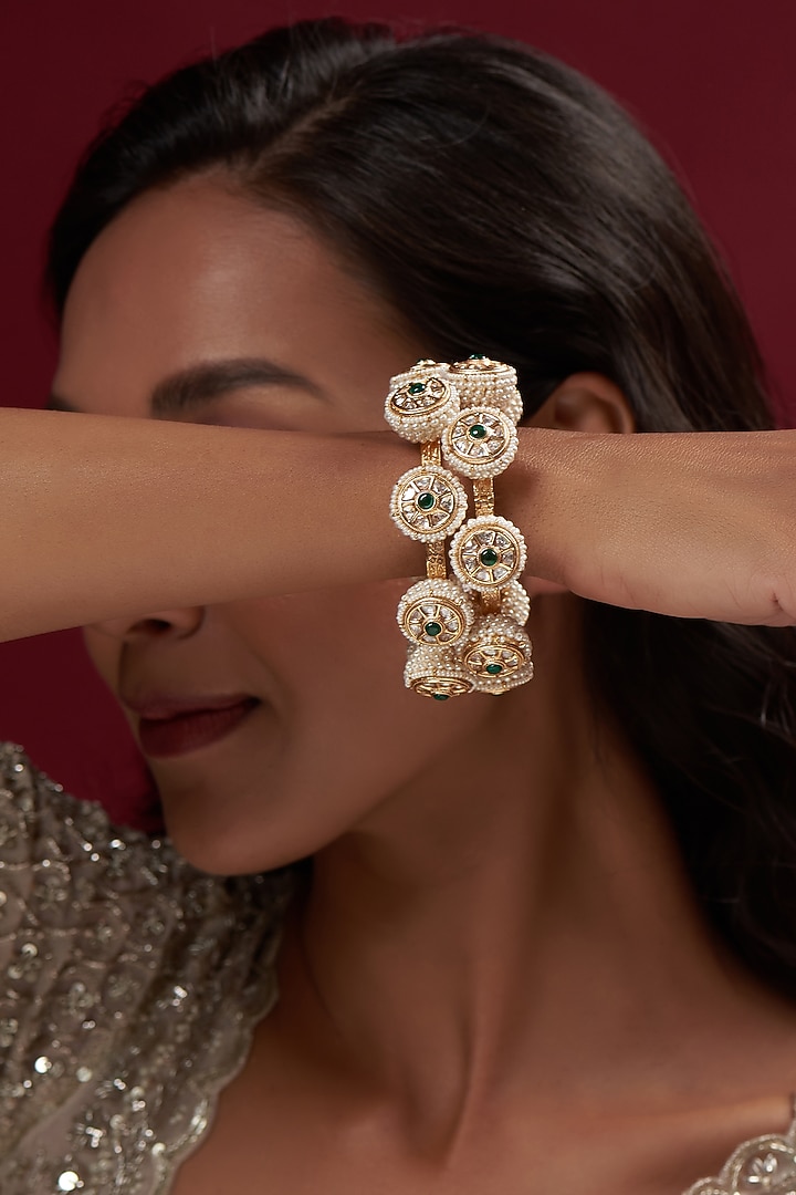 Gold Finish Pearl Bangles (Set Of 2) by Vivinia By Vidhi Mehra at Pernia's Pop Up Shop