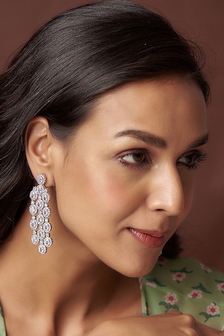 White Finish Zircon Dangler Earrings by Vivinia By Vidhi Mehra at Pernia's Pop Up Shop