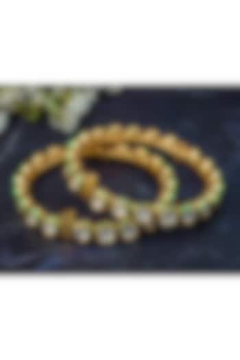 Gold Finish Kundan Polki Bangles (Set Of 2) by Vivinia By Vidhi Mehra at Pernia's Pop Up Shop