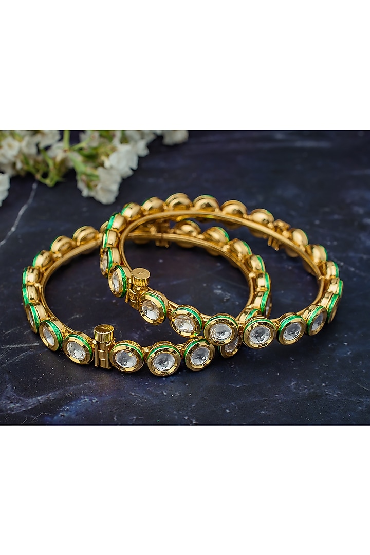 Gold Finish Kundan Polki Bangles (Set Of 2) by Vivinia By Vidhi Mehra at Pernia's Pop Up Shop