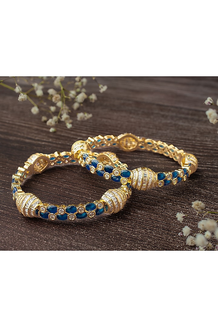 Gold Finish Kundan Polki & Deep Blue Gemstone Bangles (Set Of 2) by Vivinia By Vidhi Mehra at Pernia's Pop Up Shop