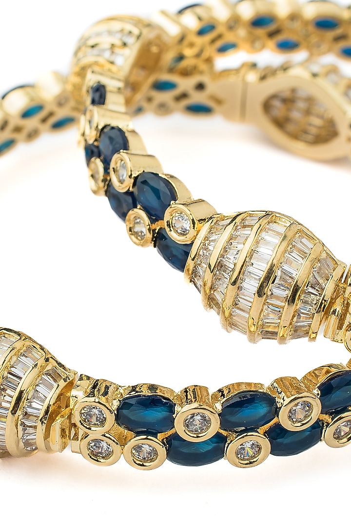 Gold Finish Kundan Polki & Deep Blue Gemstone Bangles (Set Of 2) by Vivinia By Vidhi Mehra at Pernia's Pop Up Shop