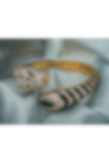 Gold Finish Green Gemstone Black Enameled Cuff Kada by Vivinia By Vidhi Mehra at Pernia's Pop Up Shop