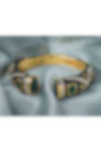 Gold Finish Emerald Green Gemstone Enameled Floral Kada by Vivinia By Vidhi Mehra at Pernia's Pop Up Shop