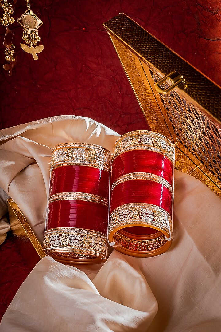 Gold Finish Red Chuda Bangles (Set Of 2) by Vivinia By Vidhi Mehra at Pernia's Pop Up Shop