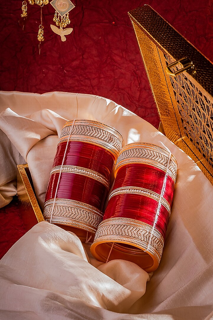 Gold Finish Red Chuda Bangles (Set Of 2) by Vivinia By Vidhi Mehra at Pernia's Pop Up Shop