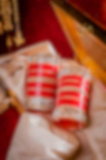 Gold Finish Red Chuda Bangles (Set Of 2) by Vivinia By Vidhi Mehra at Pernia's Pop Up Shop