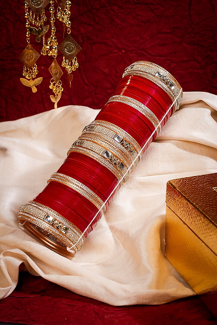 Gold Finish Red Chuda Bangles (Set Of 2) by Vivinia By Vidhi Mehra at Pernia's Pop Up Shop