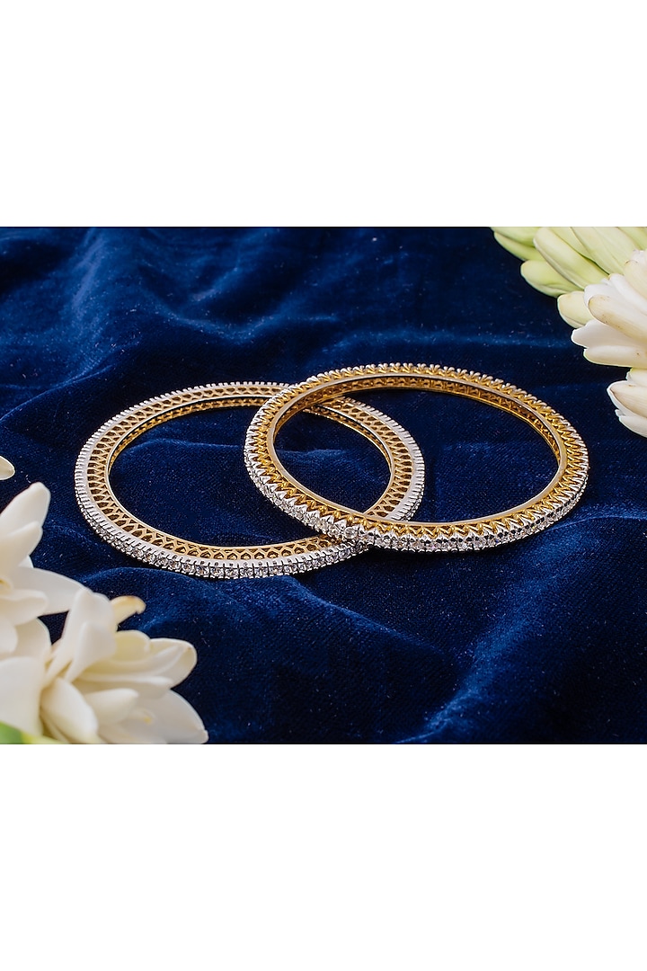 Gold Finish Cubic Zirconia Bangles (Set Of 2) by Vivinia By Vidhi Mehra at Pernia's Pop Up Shop