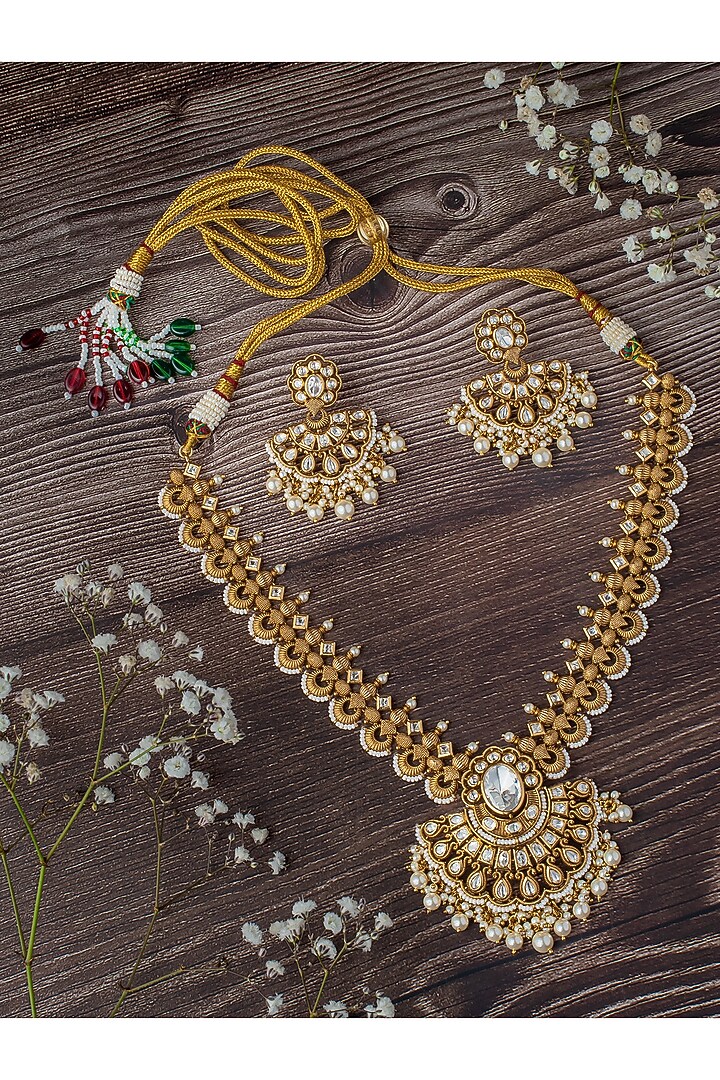Gold Finish Kundan Polki Necklace Set by Vivinia By Vidhi Mehra at Pernia's Pop Up Shop