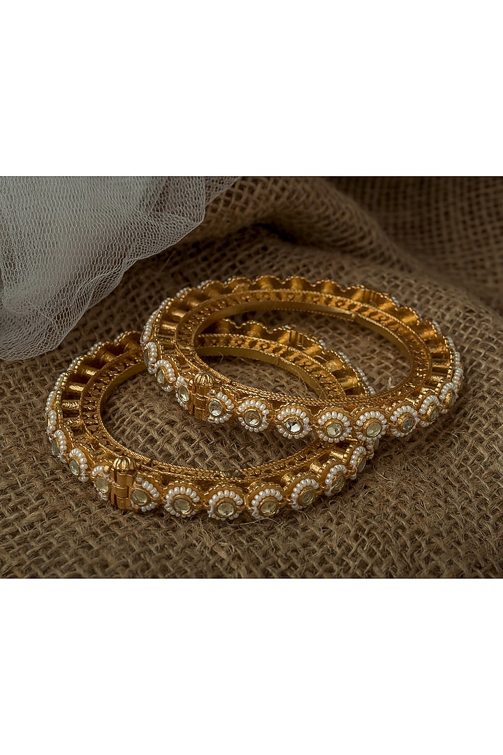 Gold Finish Kundan Polki & Gemstone Bangles (Set Of 2) by Vivinia By Vidhi Mehra at Pernia's Pop Up Shop