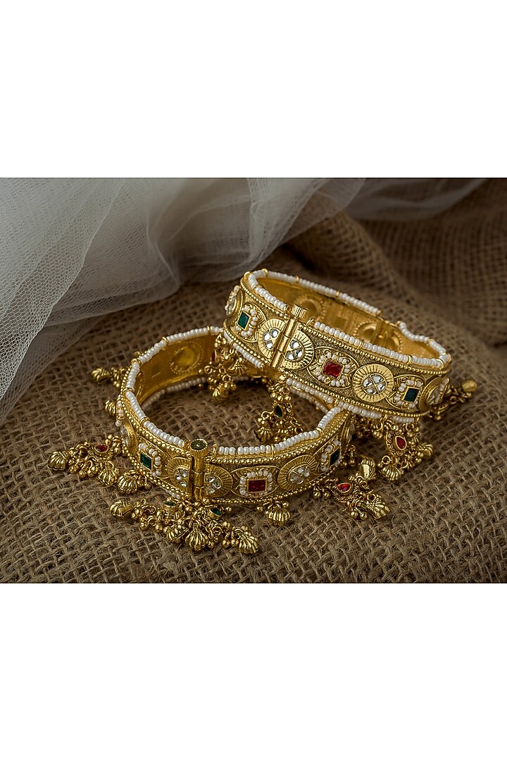 Gold Finish Kundan Polki & Gemstone Bangles (Set Of 2) by Vivinia By Vidhi Mehra at Pernia's Pop Up Shop