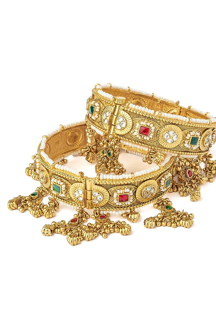 Gold Finish Kundan Polki & Gemstone Bangles (Set Of 2) by Vivinia By Vidhi Mehra at Pernia's Pop Up Shop