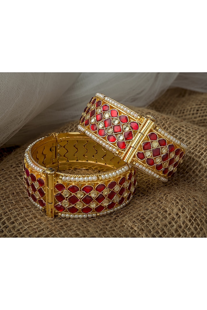Gold Finish Red Kundan Polki Bangles (Set Of 2) by Vivinia By Vidhi Mehra at Pernia's Pop Up Shop