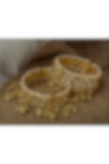 Gold Finish Kundan Polki Bangles (Set Of 2) by Vivinia By Vidhi Mehra at Pernia's Pop Up Shop