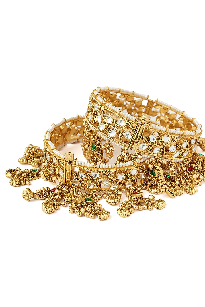 Gold Finish Kundan Polki Bangles (Set Of 2) by Vivinia By Vidhi Mehra at Pernia's Pop Up Shop