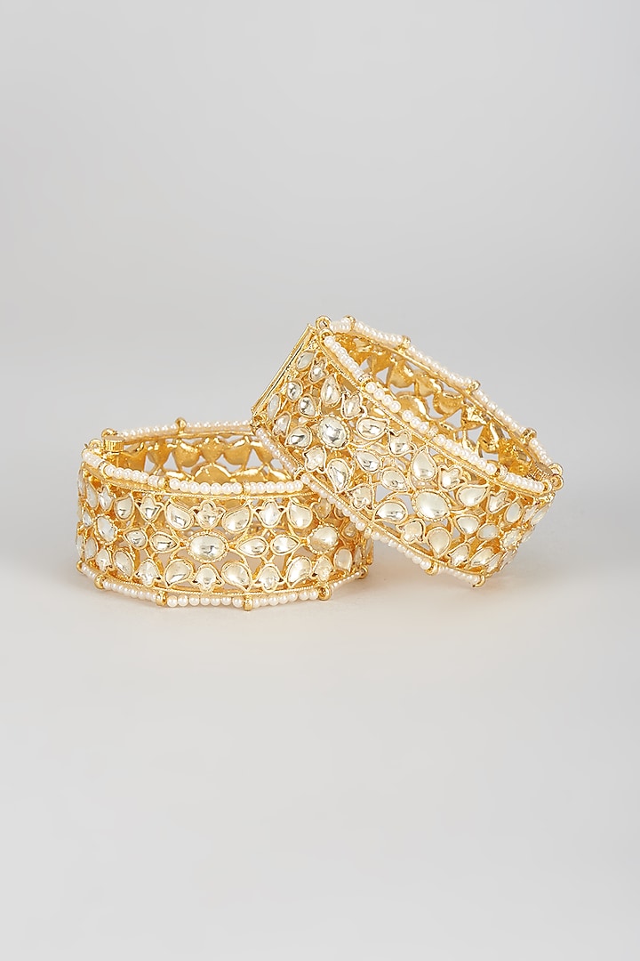 Gold Finish Kundan Polki Bangles (Set Of 2) by Vivinia By Vidhi Mehra at Pernia's Pop Up Shop