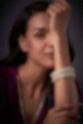 Gold Finish White Kundan Polki Bangles (Set of 2) by Vivinia By Vidhi Mehra at Pernia's Pop Up Shop