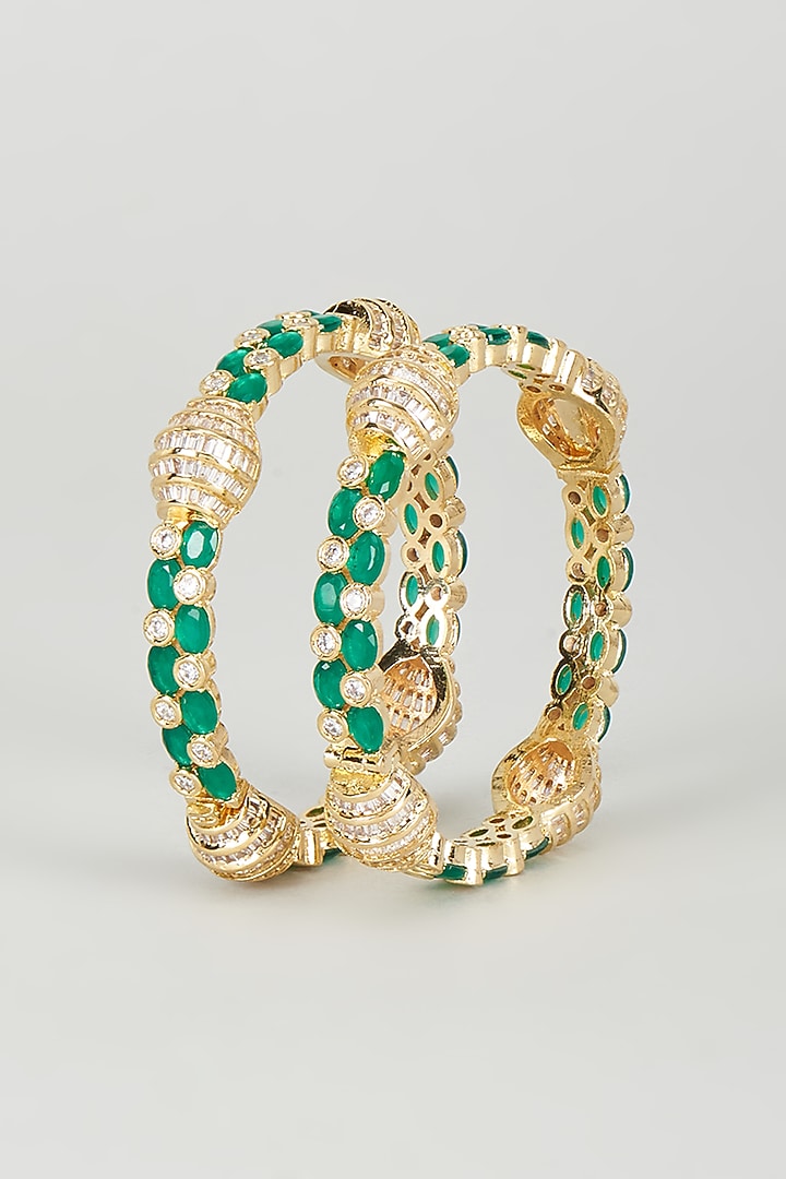 Gold Finish Emerald Synthetic Stone Bangles (Set of 2) by Vivinia By Vidhi Mehra at Pernia's Pop Up Shop
