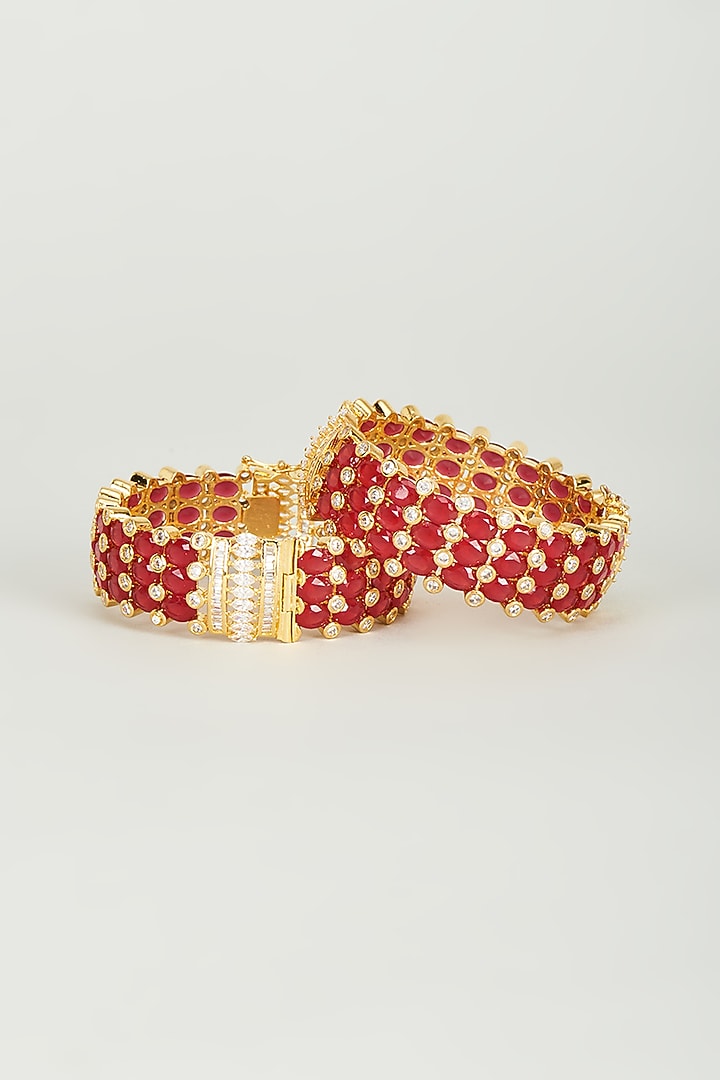 Gold Finish Red Synthetic Stones Bangles (Set of 2) by Vivinia By Vidhi Mehra at Pernia's Pop Up Shop